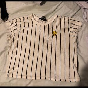 Striped crop top with smiley face decal